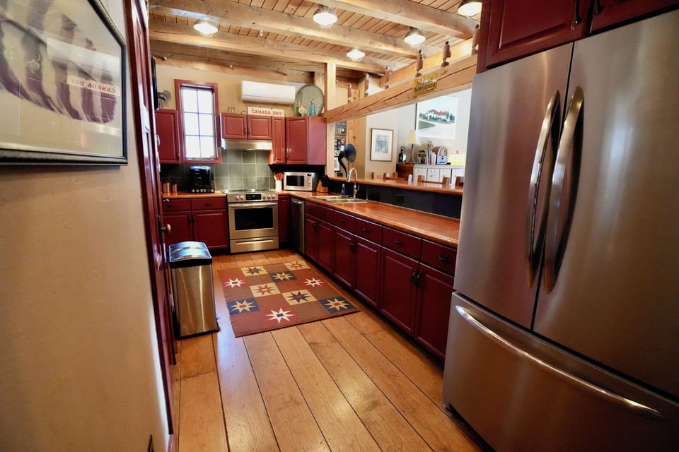 Spacious chef's kitchen with stainless appliances and plenty of counter space.