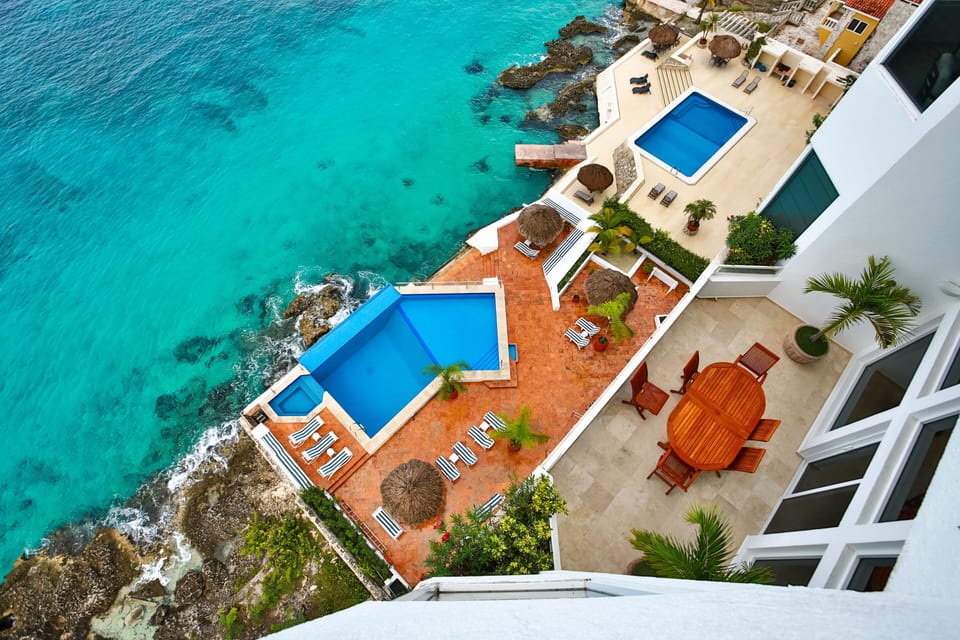 View of pool deck and ocean (there's amazing snorkelling!)