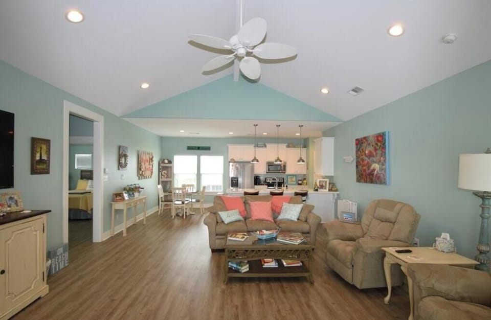 Spacious open living area with vaulted ceilings.