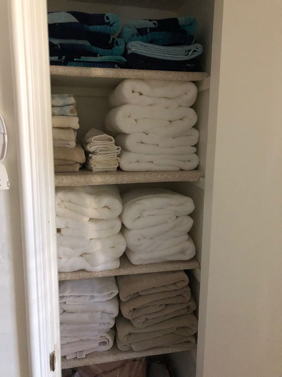 Fluffy towels, organized linen closet