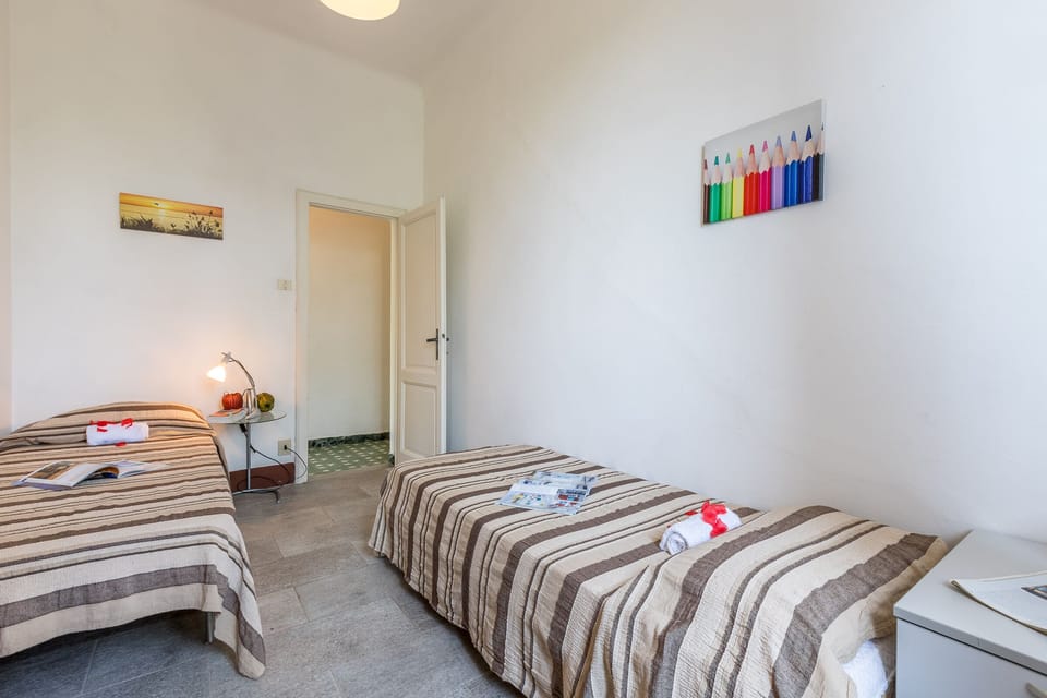 third bedroom with 2 single beds and wardrobe