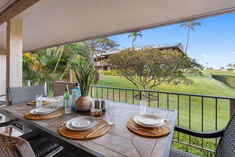 Enjoy outdoor dining on your private lanai overlooking the golf course and a peak of the ocean