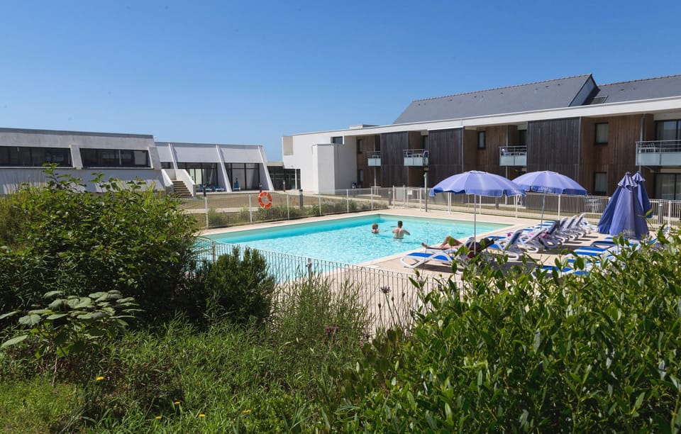 Lounge by the pool in the sunshine.