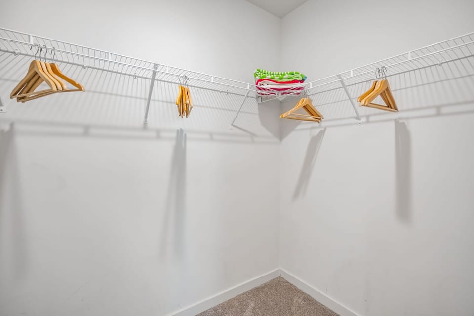 Spacious Closet with Ironing Supplies - Short Term Corporate Rentals - Spectacular Suites