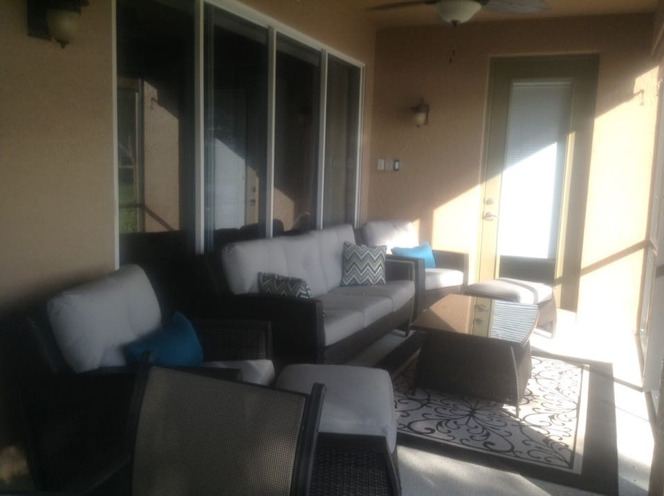 Lanai with new furniture.  Also has dining table