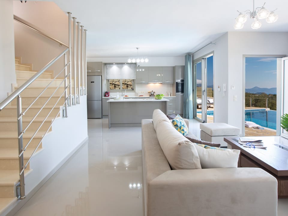 Modern living room with a kitchen in new villa Crystal