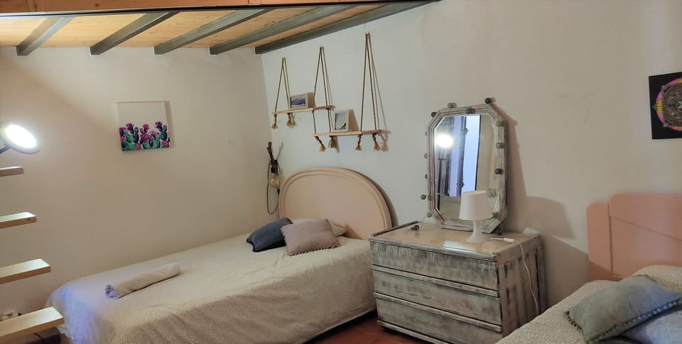 Room 2 with 2 double beds and 1 single bed. 