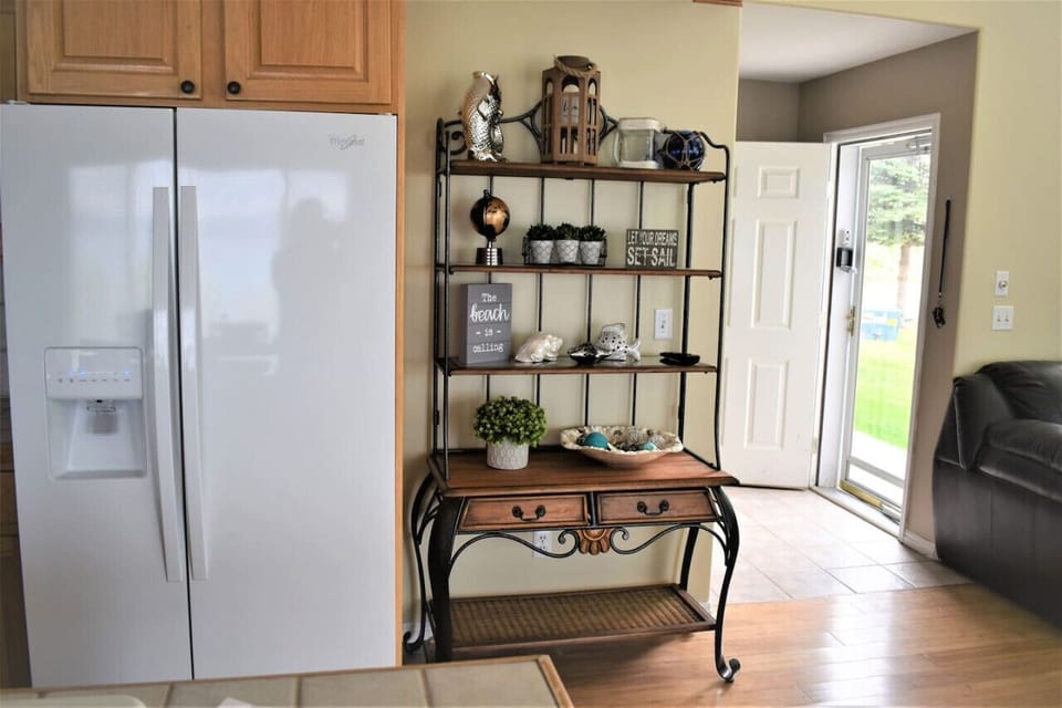 Charming coastal decor nook welcomes you with warm accents and cheerful seaside vibes.