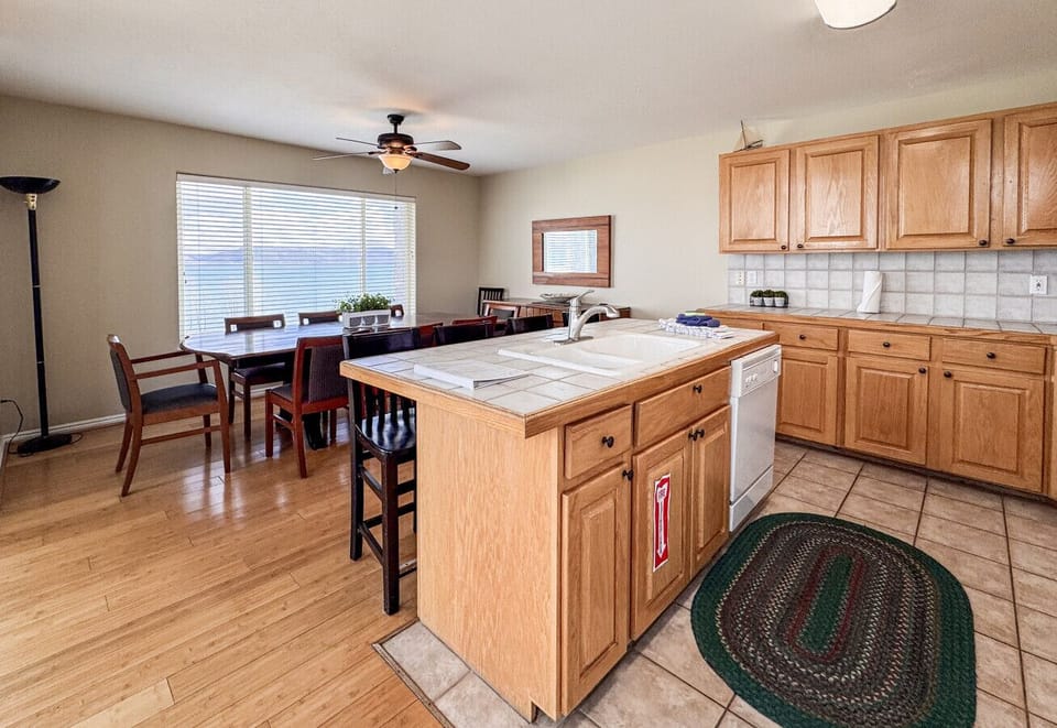Spacious kitchen with warm wood finishes—perfect for gathering, cooking, and creating lasting memories.