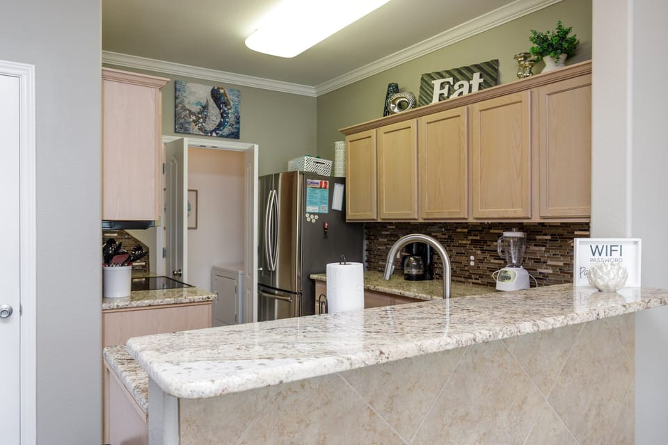 Your spacious kitchen features granite countertops, stainless appliances, and warm wood cabinets where you'll love preparing meals and morning coffee together.
