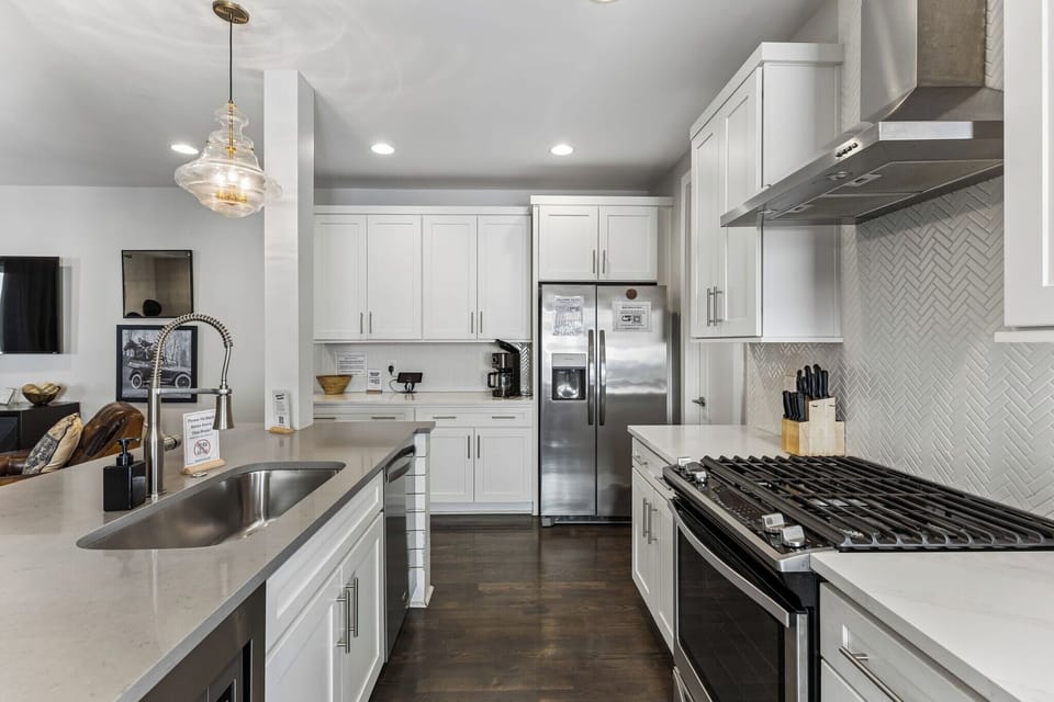 Cook for the whole group without feeling cramped — island with sink, full-size appliances, and enough counter space to actually prep a real meal.