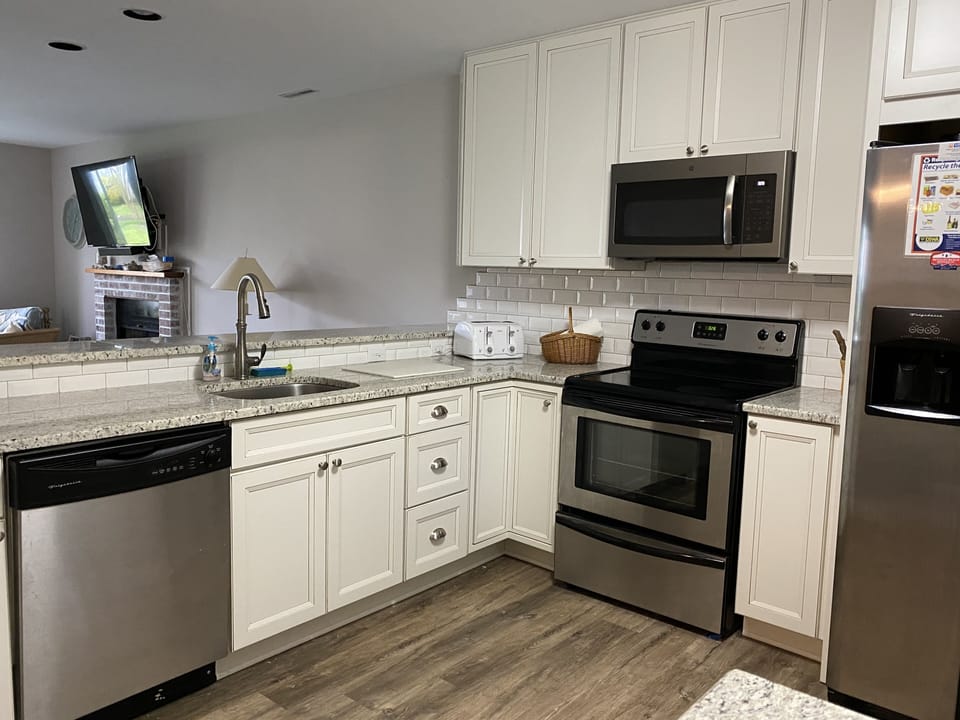 Updated and fully stocked kitchen  that overlooks the living room