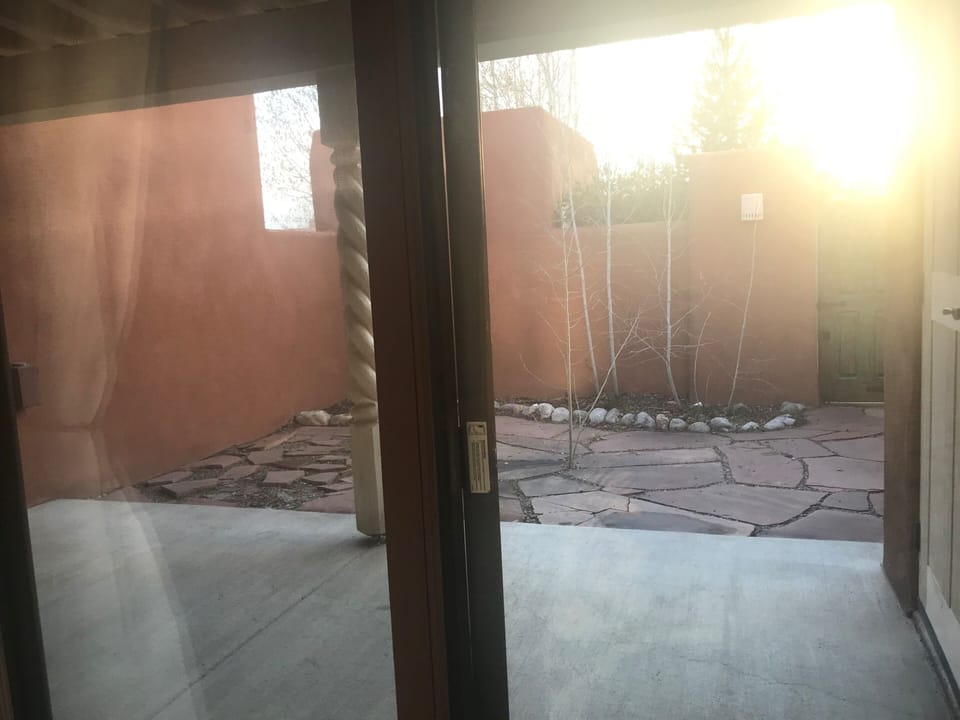 Private patio with yard