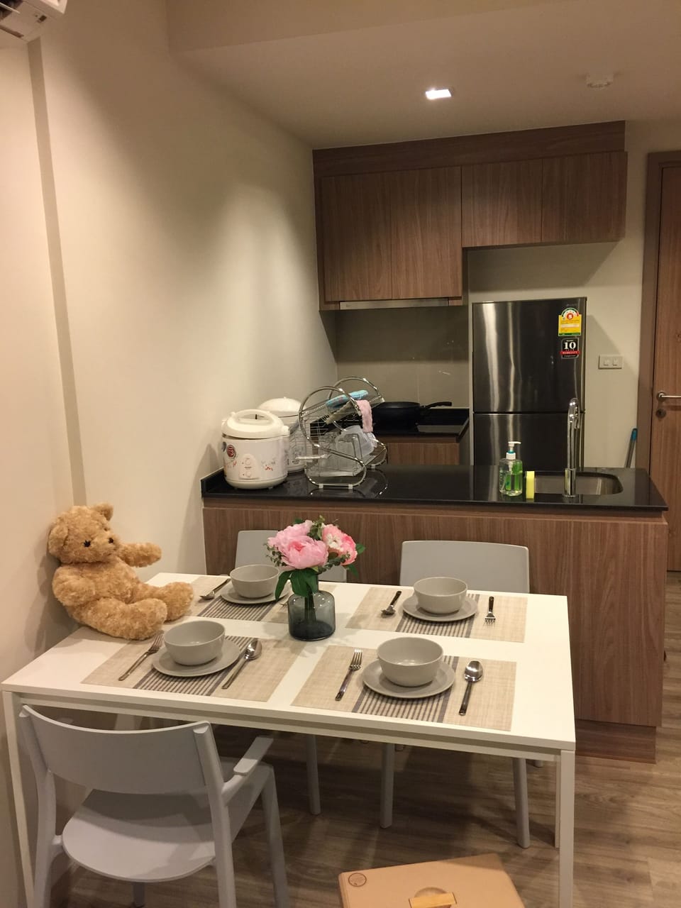Dining table seats and kitchen @RAINCHAAMHUAHIN