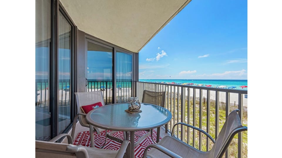 Step onto your private beachfront balcony and savor morning coffee with stunning ocean views stretching endlessly before you.