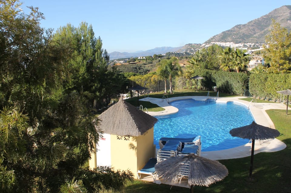 Large communal pool set in beautiful landscaped gardens.