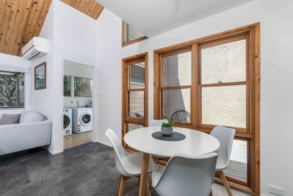 Breakfast table, internal courtyard and laundry with washer, dryer and toilet.