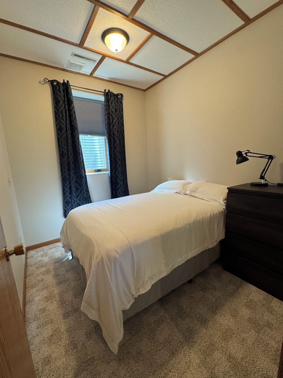 Our 4th bedroom has a double bed, full dresser & large window w/blackout curtain