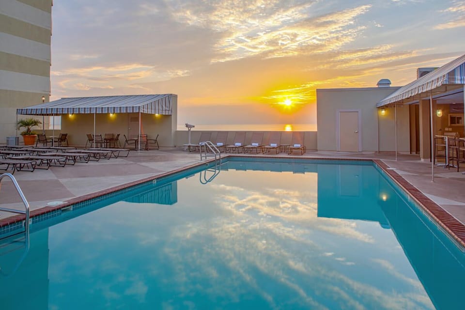 Rooftop pool with bar and restaurant. 
