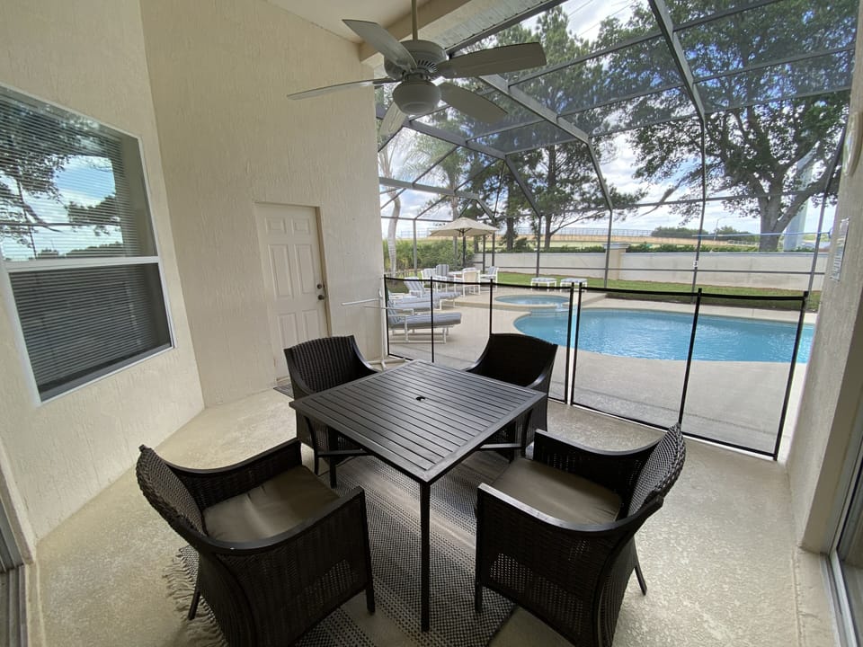 Seating area with pool safety fence to block off pool area