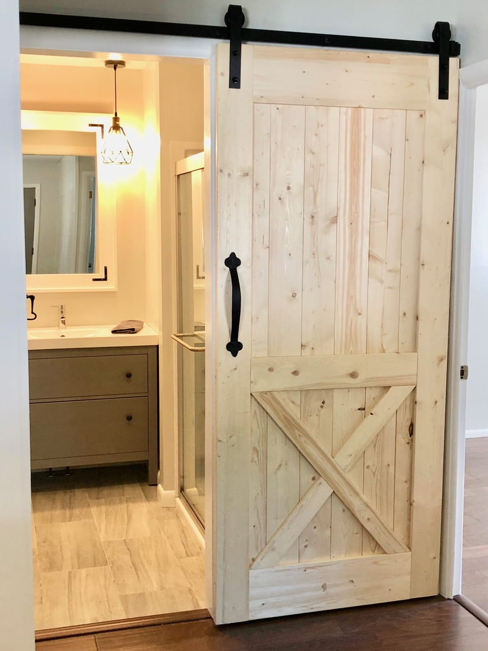 The bathroom includes a walk in shower, toilet, vanity/sink & small closet