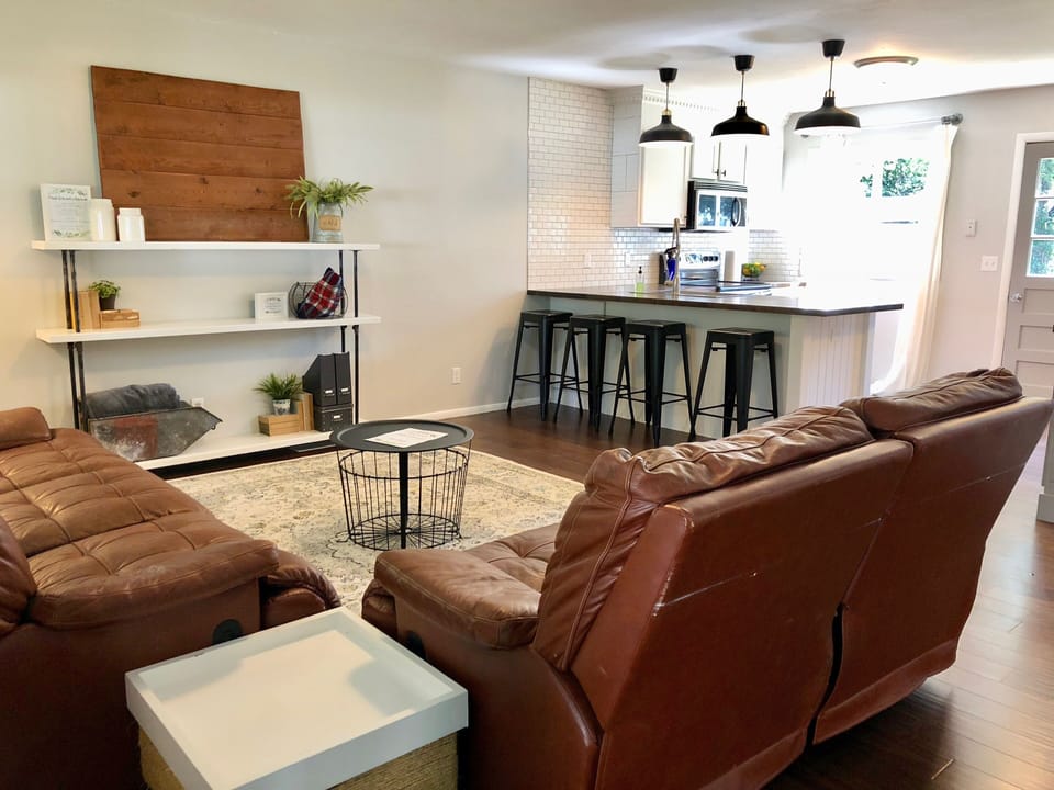 Super comfy yet stylish living area that is open to the kitchen area.