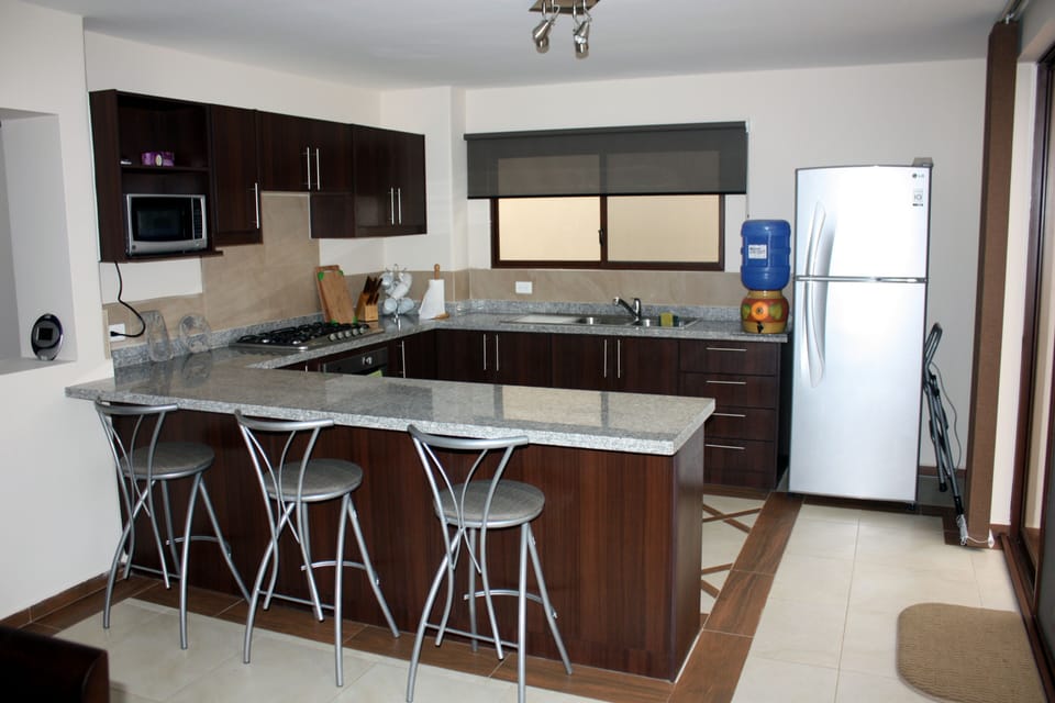 and kitchen with breakfast bar.