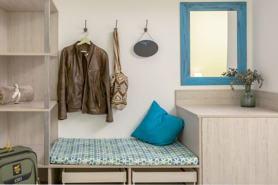 2nd bedroom - Closer view of closet area with mirror with staged items