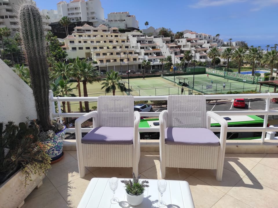 Terrace with lounge and Tennis court view