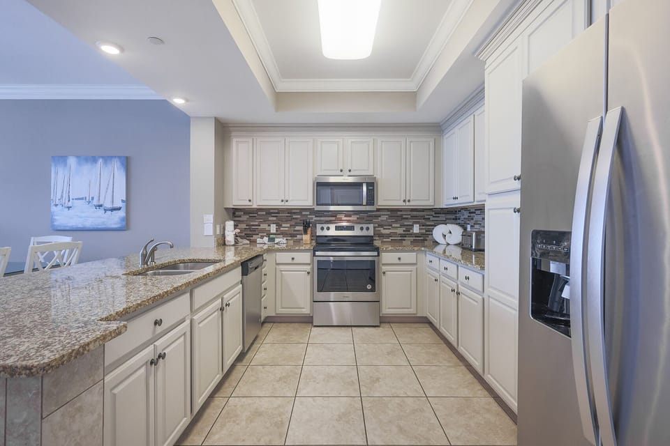 Craft delightful culinary creations in the spacious kitchen, perfect for sharing joyful moments with loved ones