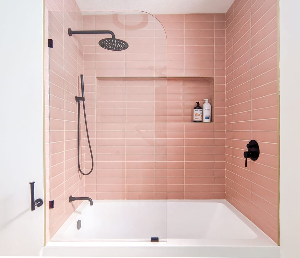 Gorgeous brand new bathroom with rain shower head and wand.