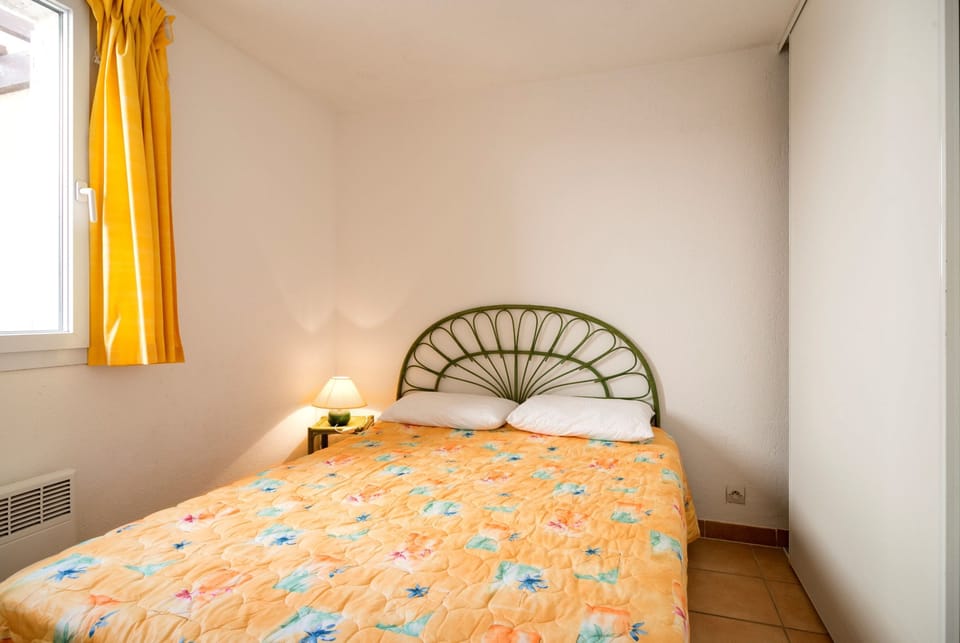 Drift to sleep in the comfortable bed in the bedroom.
