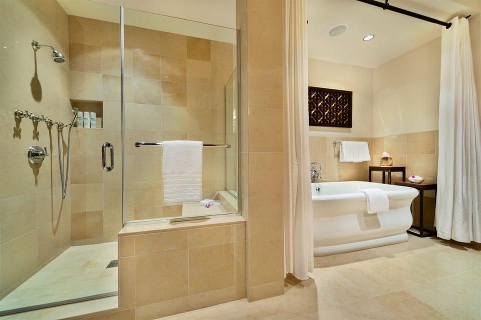 Master En-Suite Bath with Deep Soaking Tub Dual Vanities Separate Glass Shower
