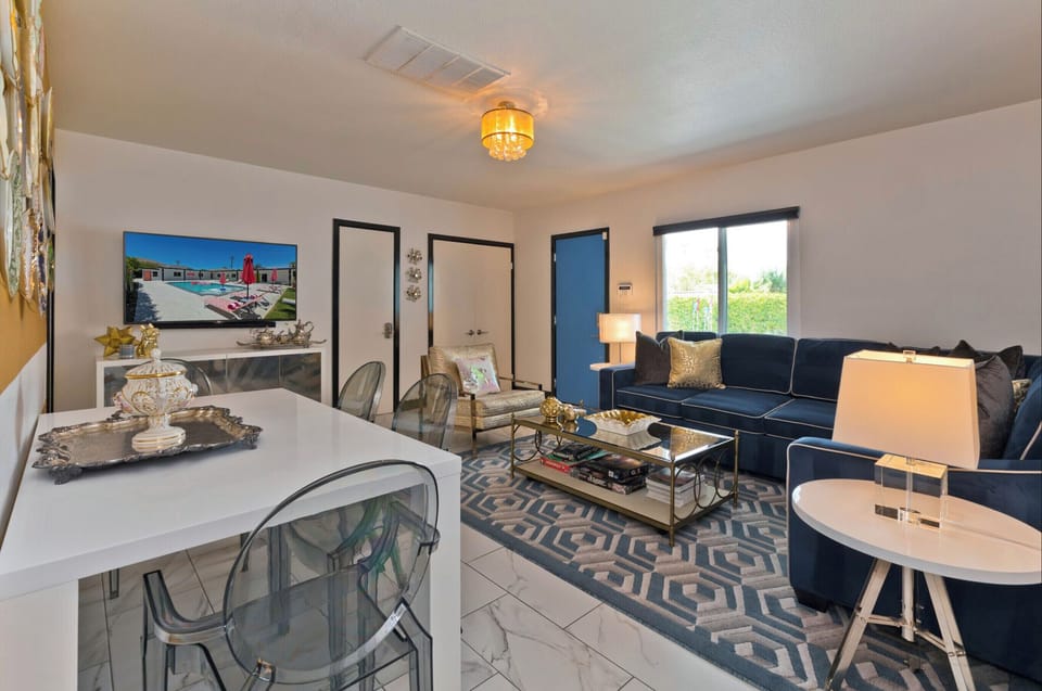View of living and dining area from entrance to bedroom 