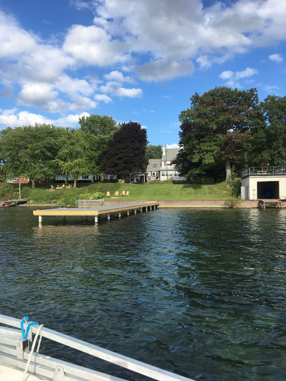 Beautiful lakefront property with fire pit and Adirondack chairs for relaxing