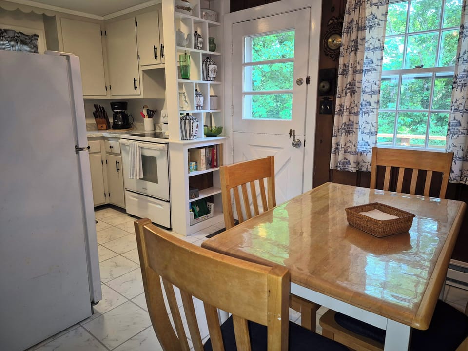 Eat-in, fully equipped kitchen, door to back deck