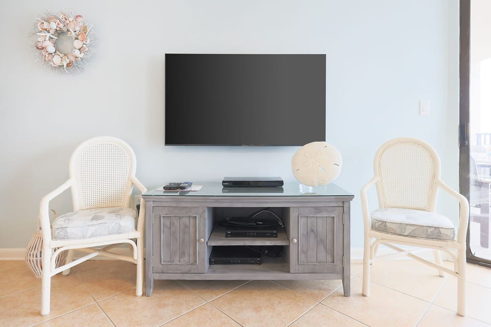 Unwind in the living space, featuring a large TV and charming decor, perfect for relaxation after a day of fun
