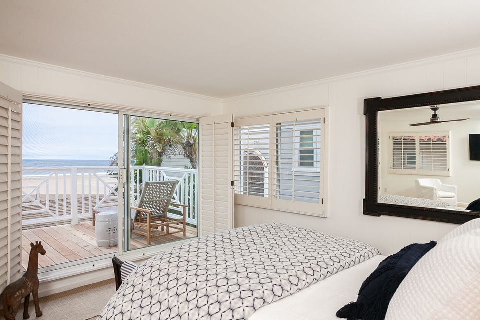 The upstairs master bedroom is the perfect place to enjoy the ocean view. 