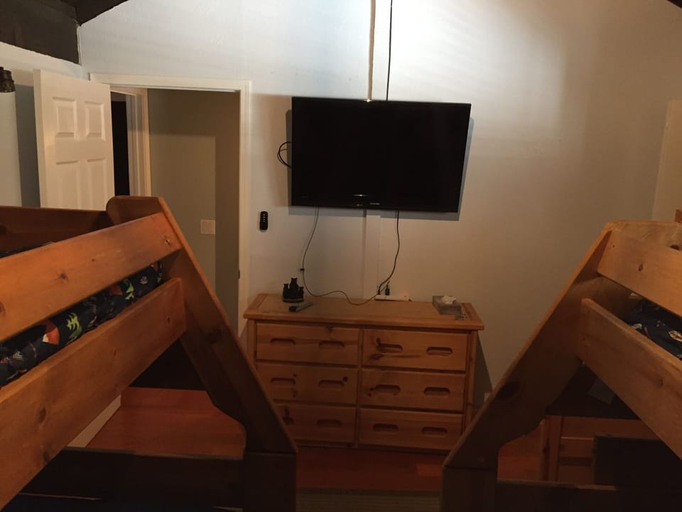 Bedroom 4. 2 bunk beds each has a full below and a single above television