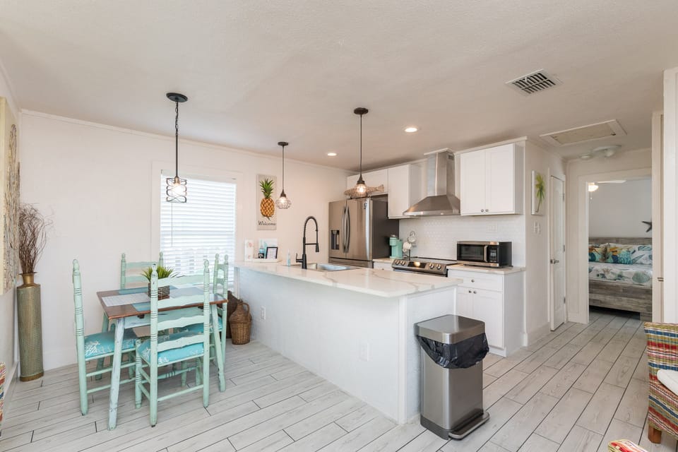 The full kitchen has granite counters and stainless steel appliances.