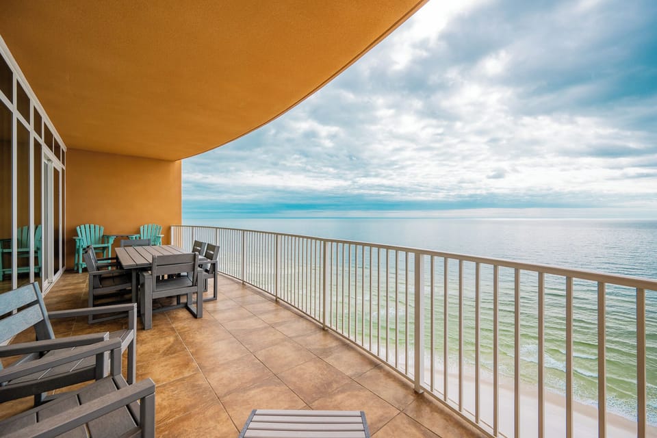 Lounge comfortably on the spacious balcony, soaking in the calming sights and sounds of the coastline