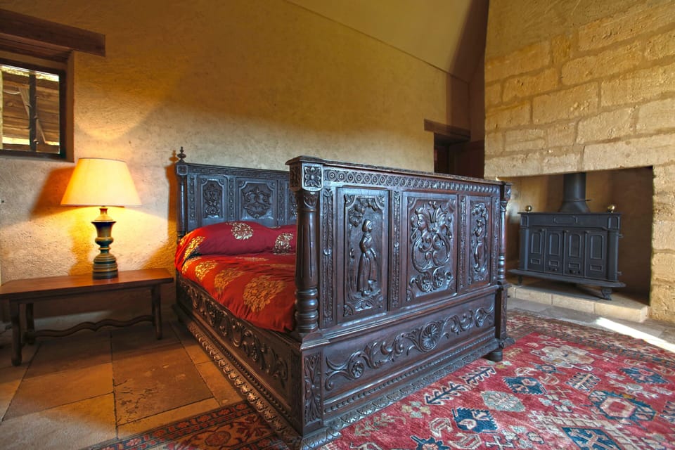 First floor bedroom
with carved bed