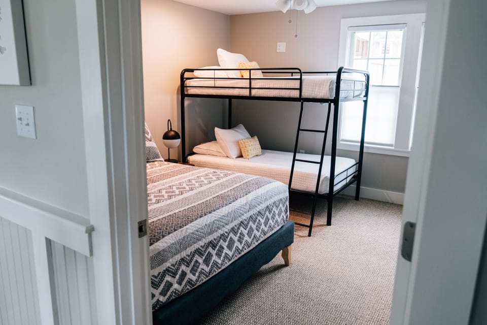 First floor bedroom, one double and two twin beds