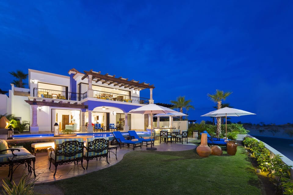 Back patio and poolside of the two story villa.