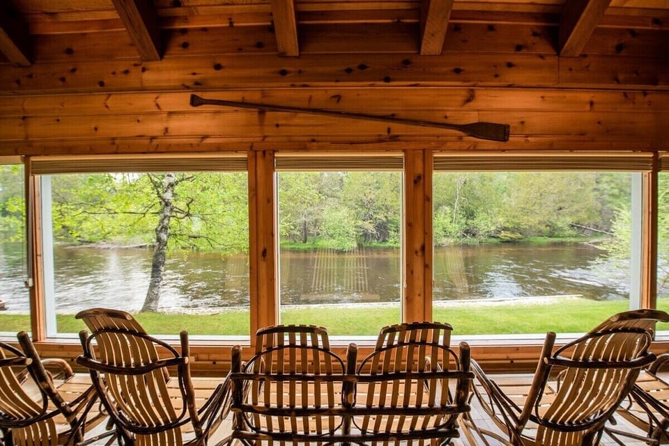 The Royal Stag Lodge overlooks the Squirrel Bend of the Au Sable River, with sprawling property grounds to fish from, explore, and make plenty of memories with family.