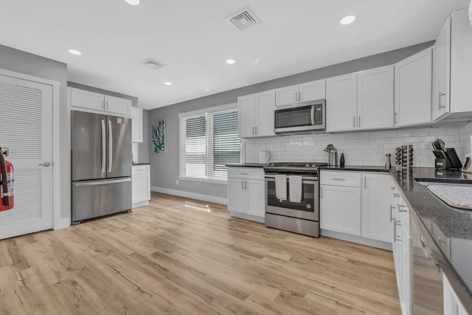Kitchen is fully stocked with dinnerware, utensils, pots, pans, spice rack, and too many others to list!