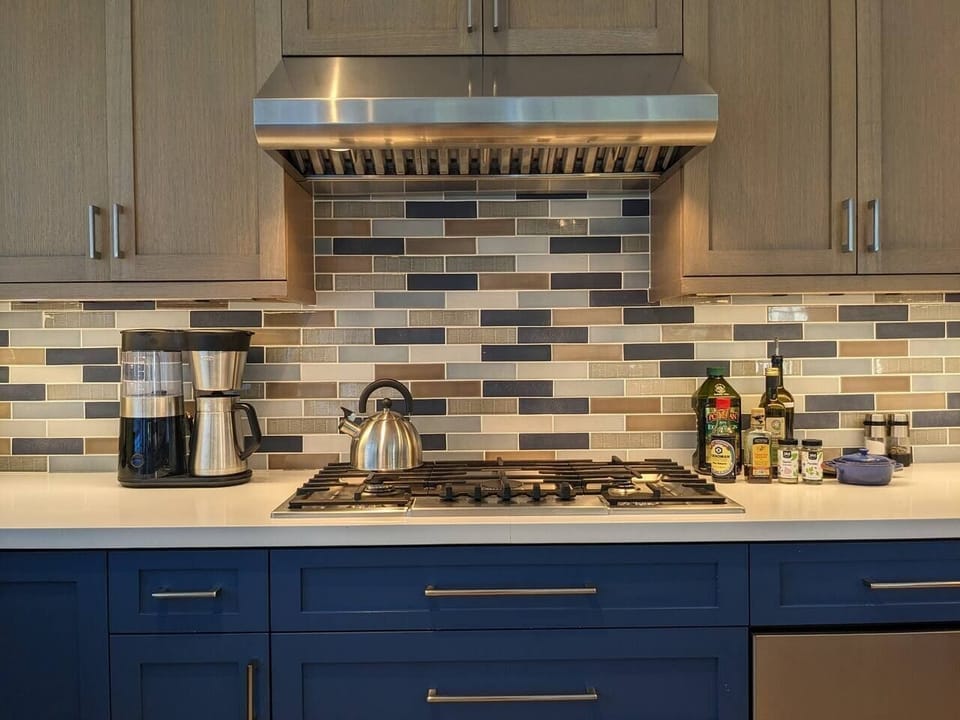A high BTU gas cooktop, stainless steel range hood, and basic oils, spices and herbs are available.
