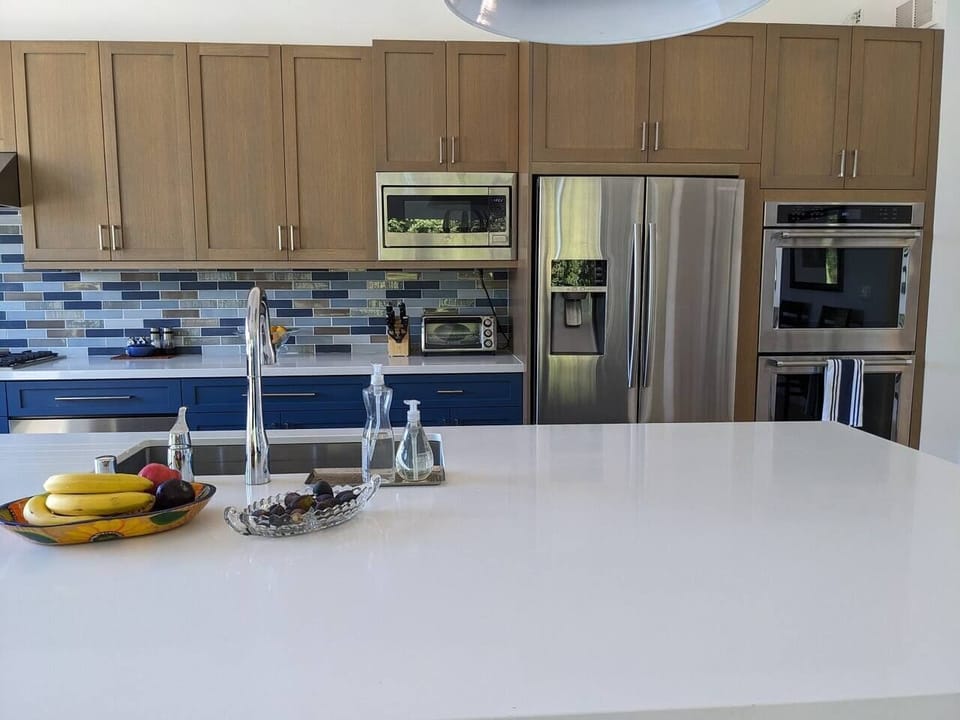 The stainless steel appliances - including a double oven and a warming drawer - make cooking in this Chef's kitchen a delight.