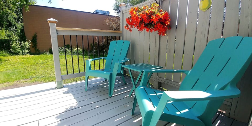 Your deck from the kitchen w/access to the backyard.