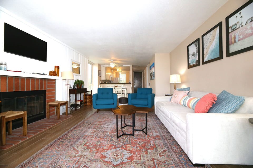 Gas fireplace and flat screen TV in living area